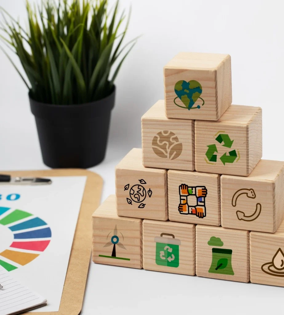 Holzklötze mit Nachhaltigkeitssymbolen demonstrieren Umweltpraktiken und Engagement