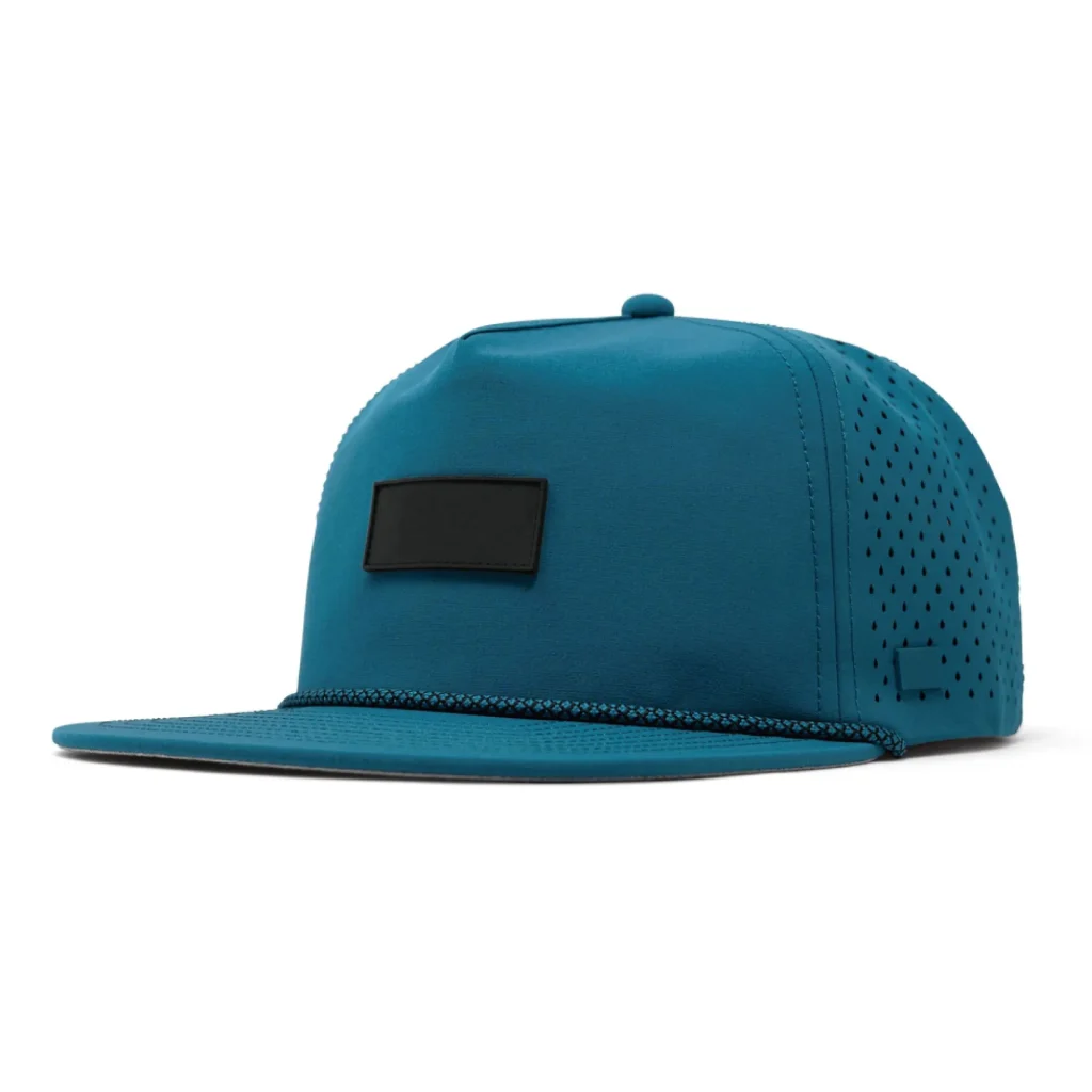 Teal snapback cap with black patch and ventilation holes