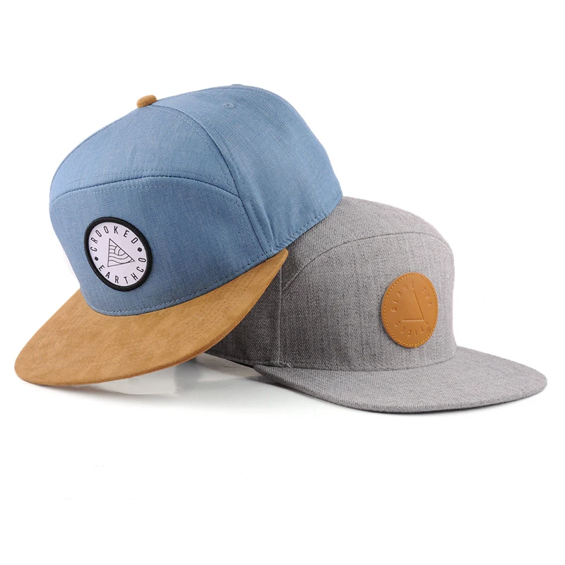 Blue and gray caps with suede brim and leather patch