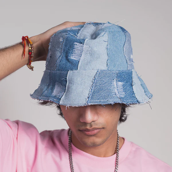Denim patchwork bucket hat worn with a pink shirt