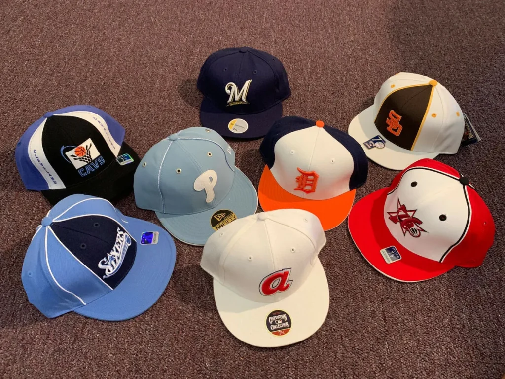 sports team hats arranged in a circle on a carpet