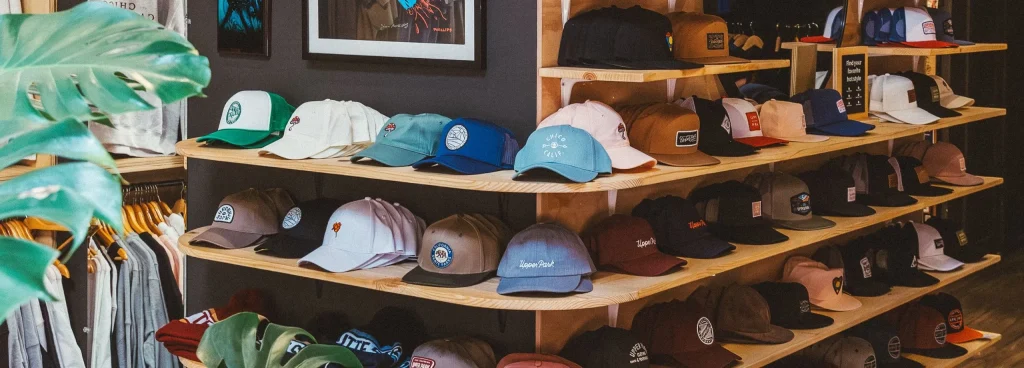 Shelf of colorful hats in a trendy store interior