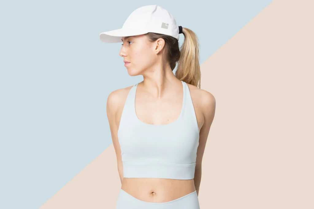 sporty woman blue cap side