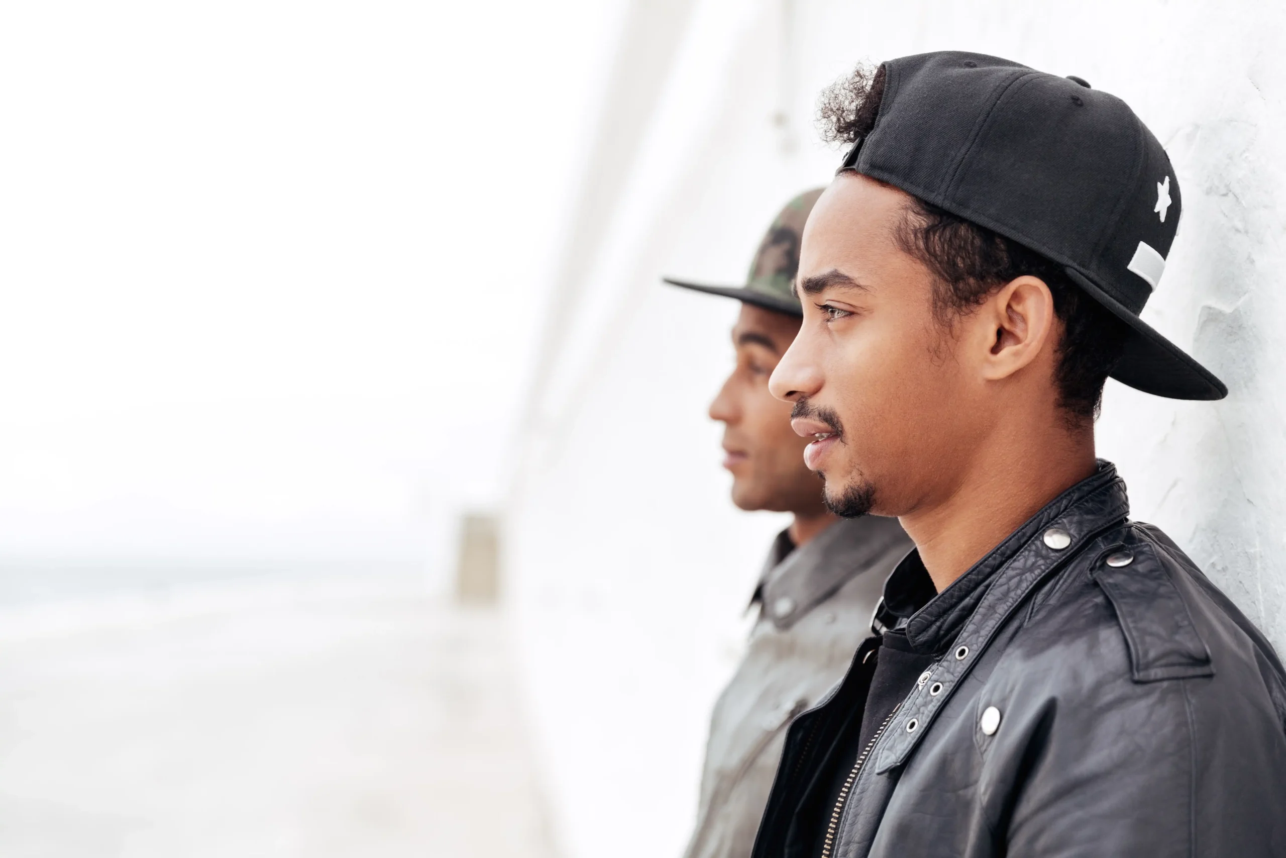 two young african men friends standing outdoors compressed two young african men friends standing outdoors compressed