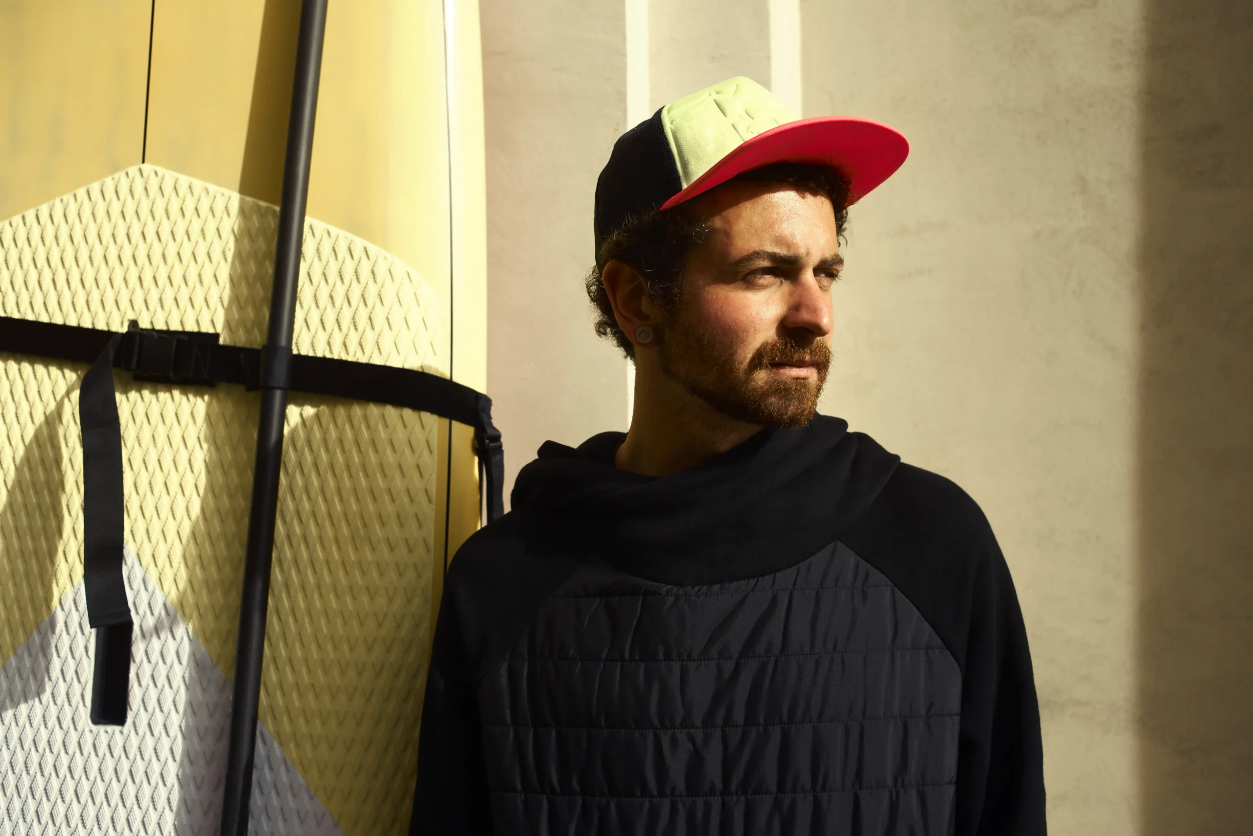 young surfer man with his surfboard compressed young surfer man with his surfboard compressed