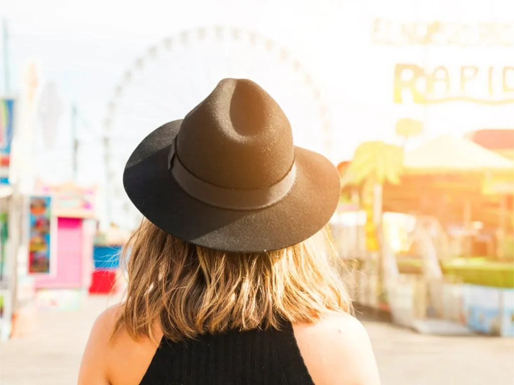 young woman wearing a bucket hat in the sunshine