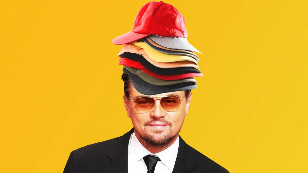 Man in suit with multiple baseball caps