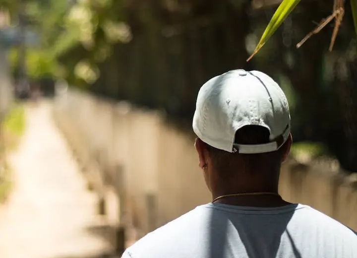 Plain white snapback hat worn by a man Plain white snapback hat worn by a man