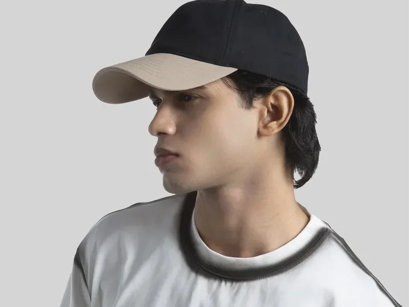 A two toned low profile hat on a person