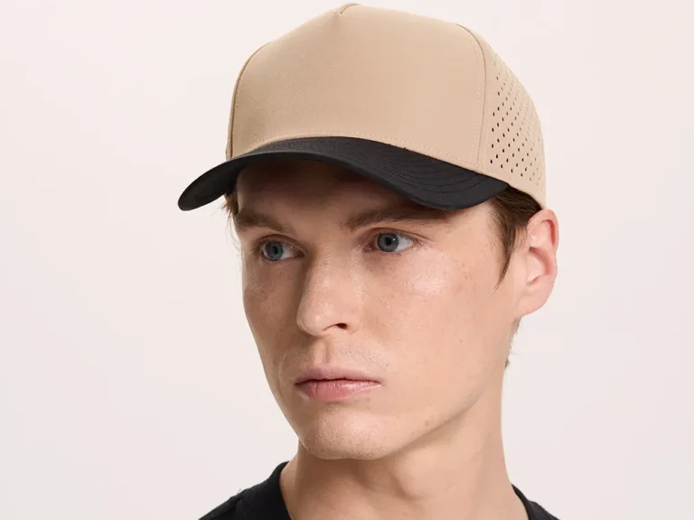 Model wearing a two-tone custom performance cap to evaluate crown fit and brim shape