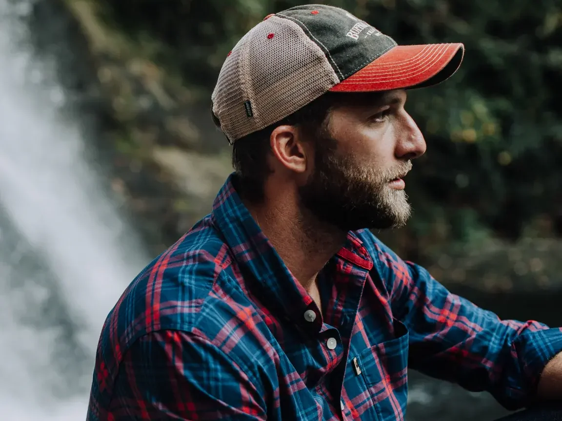 A red trucker cap with a front brand patch
