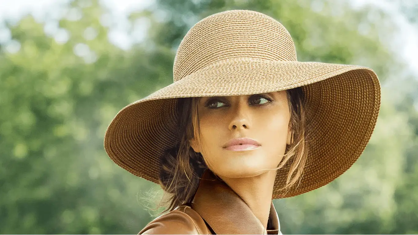 Woman wearing wide brimmed straw sustainable hat Woman wearing wide brimmed straw sustainable hat