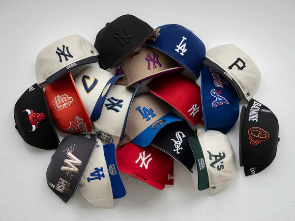 Collection of assorted New Era baseball team caps